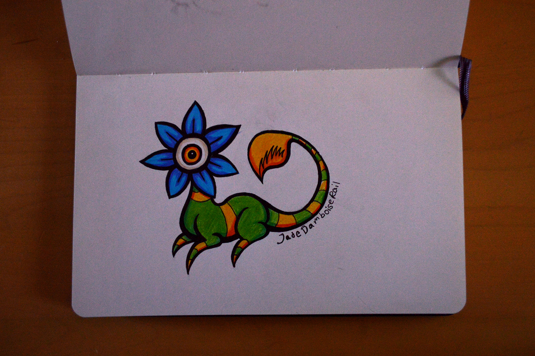 Four legged creature with a flower for a head with an eye between the petals. The tail is a carniverous plant mouth.