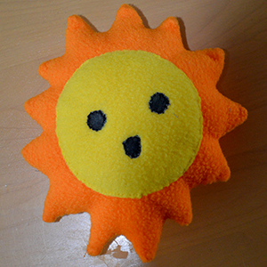 sun shaped toy with face