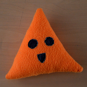 triangle shaped plush toy with face