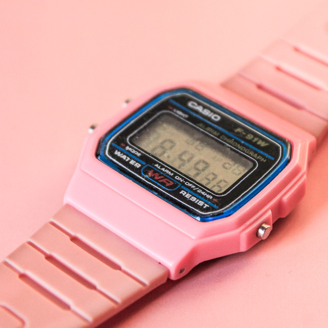 Product photography of a pink vintage Casio watch