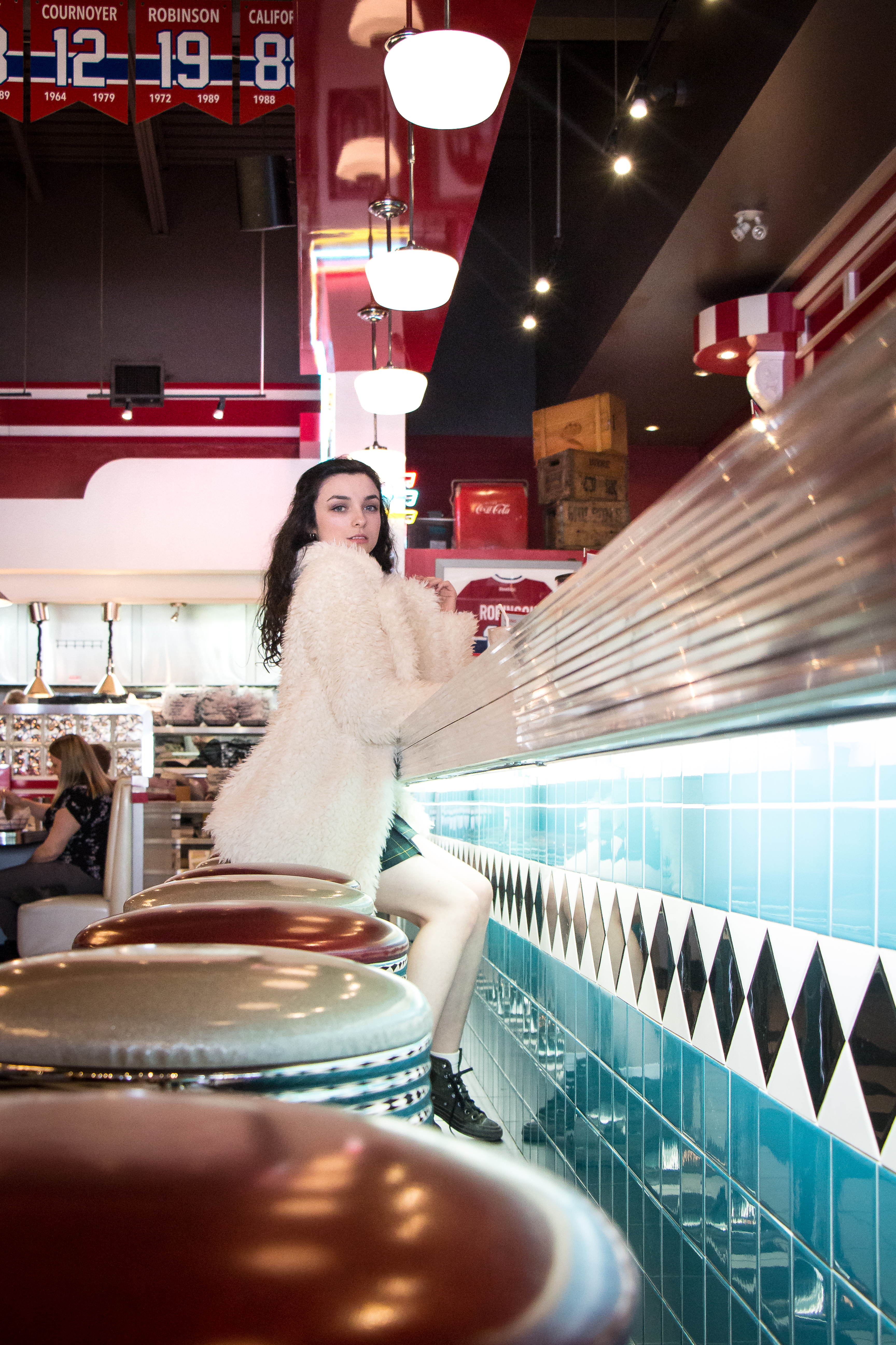 1950s styled picture of girl in diner