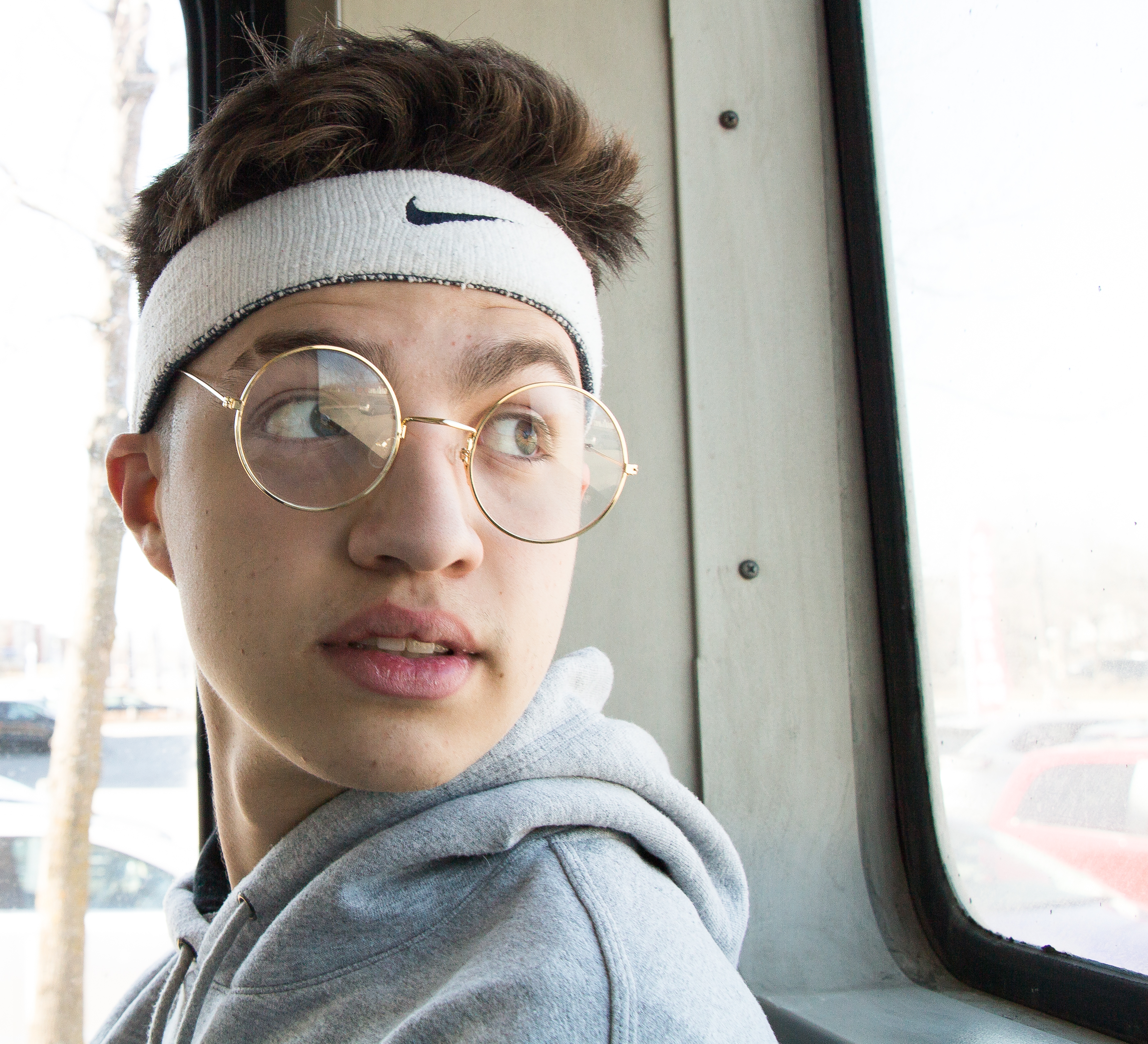 Cristina DeLuca's edited photograph of a boy looking out a window