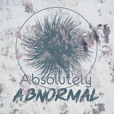 A high-resolution version of the logo on a grungy wall for Absolutely Abnormal, a sticker company Janelle Bryan and Zachary Taillefer designed for Branding class in 2019