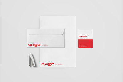 Envelope slightly laid over a letterhead in the center of artboard with two business cards on the right side displaying the front and back, and white stapler in the bottom left. Exige Marketing logo displayed in bottom left of each piece.