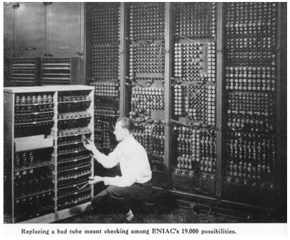 U.S. Army Photo from M. Weik, A technician changes a bad tube in the ENIAC computer circa 1940.