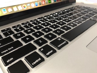 a close up picture of a macintosh laptop keyboard