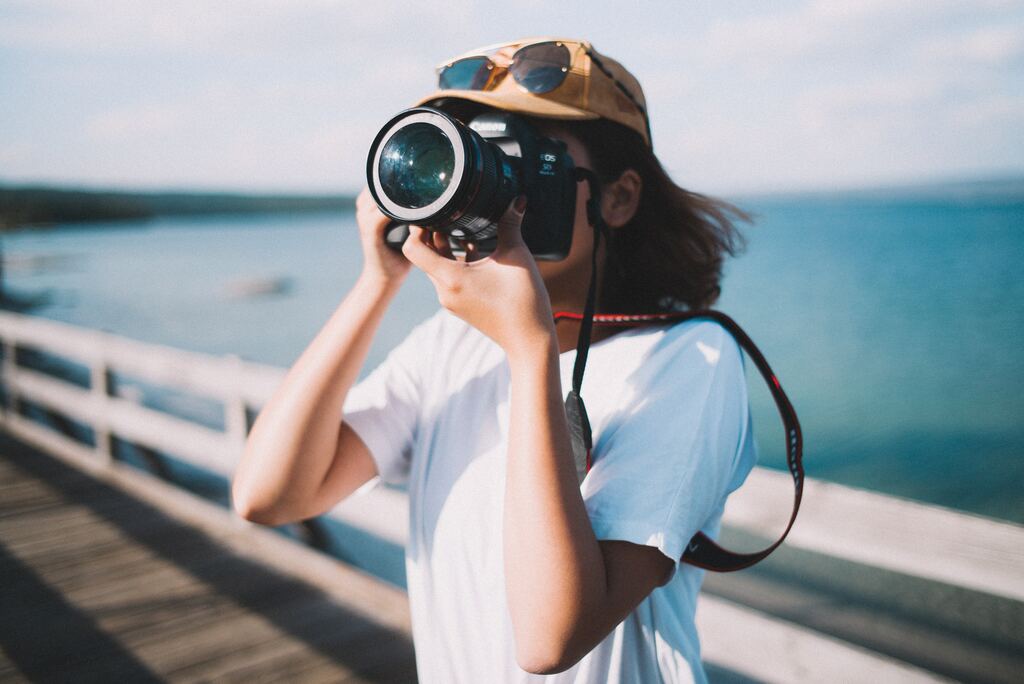 girl taking photo with canon